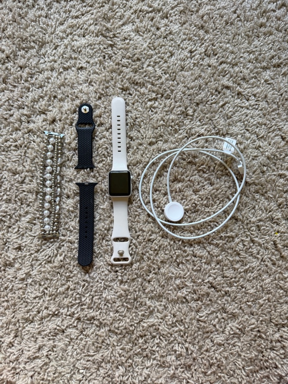 Apple Watch with White Sport Band and Charging Cable